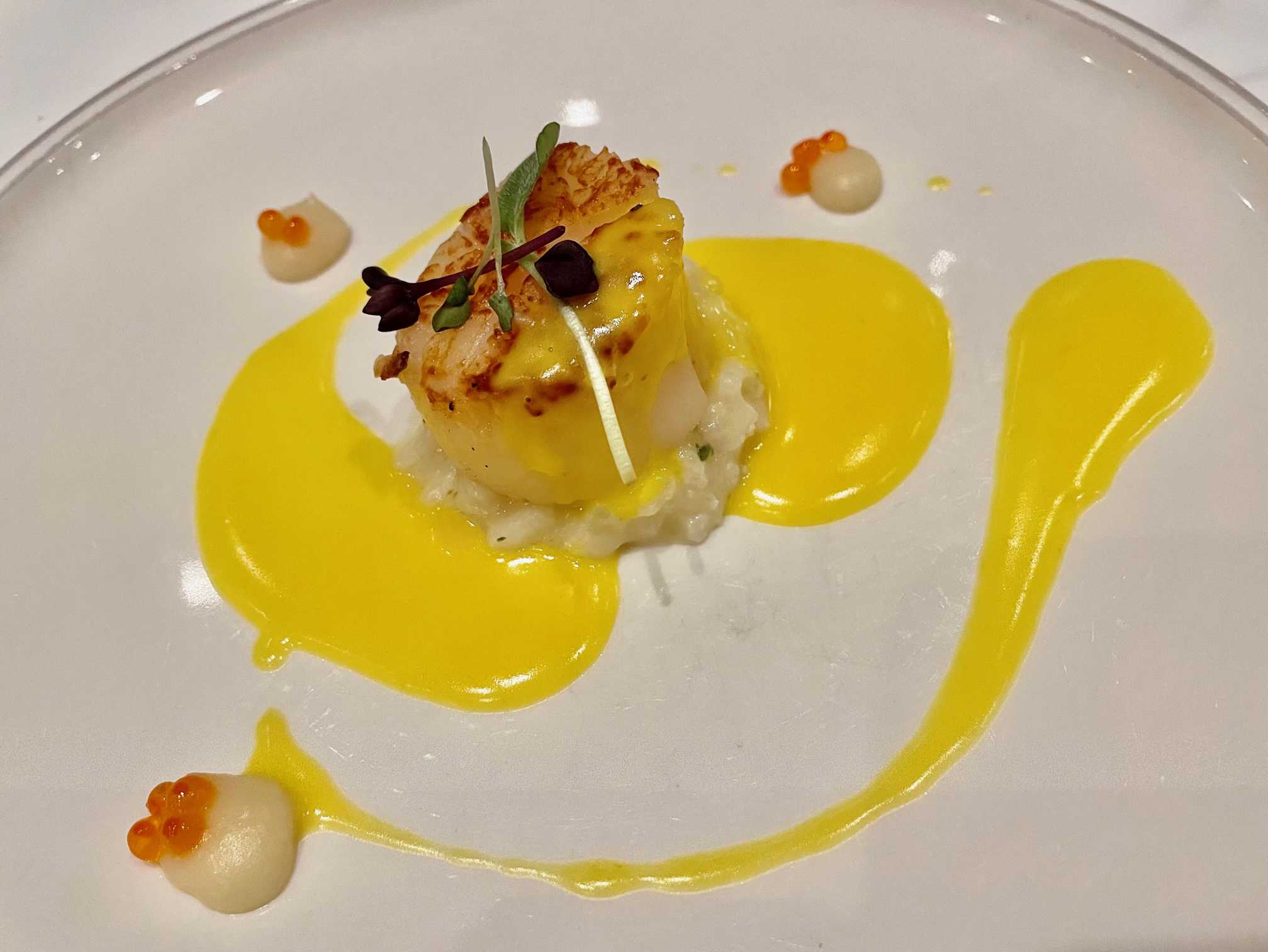 Beautifully plated scallop appetizer on Tauck River Cruises